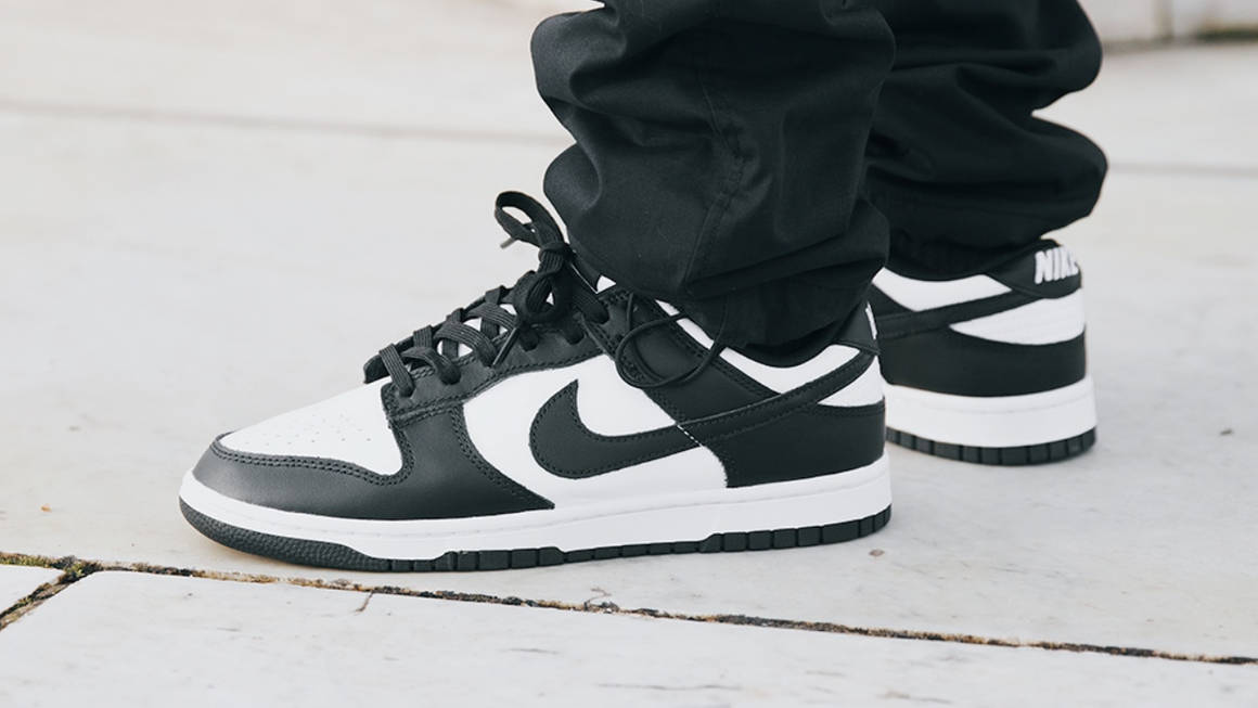 Nike Dunk Low Retro Sneakers in 'White Black' worn on feet